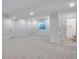 Open basement area with neutral carpet, recessed lighting, and access to bathroom and other rooms at 3336 N Haleyville Ct, Aurora, CO 80019