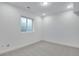 Finished basement with neutral carpet, recessed lighting, and a small window at 3336 N Haleyville Ct, Aurora, CO 80019
