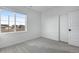 Bedroom featuring carpet flooring, a large window, and a neutral color palette, creating a bright and inviting space at 3336 N Haleyville Ct, Aurora, CO 80019