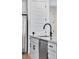 Close up of kitchen featuring stainless steel appliances, granite countertops, a sink, and white cabinets at 3336 N Haleyville Ct, Aurora, CO 80019