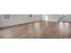 Bright living room featuring hardwood floors and white walls at 3336 N Haleyville Ct, Aurora, CO 80019