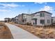 Street view showcasing a row of modern homes and a sidewalk at 3336 N Haleyville Ct, Aurora, CO 80019