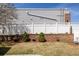 Backyard features a terraced garden with white fence and manicured trees at 4555 Andes St, Denver, CO 80249