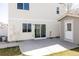 Backyard patio with sliding glass doors to the house and a detached shed at 4555 Andes St, Denver, CO 80249