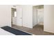 Neutral bedroom showcases carpeted floors, closet, and ensuite bathroom at 4555 Andes St, Denver, CO 80249