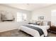 Serene bedroom with large window, modern art, and comfortable bedding at 4555 Andes St, Denver, CO 80249