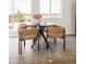 Cozy dining area featuring seating for four, bathed in natural light from the large window at 4555 Andes St, Denver, CO 80249