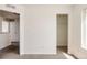 Neutral hallway with carpet and closet, offering convenient storage space at 4555 Andes St, Denver, CO 80249