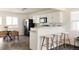 Modern kitchen with stainless steel appliances, white cabinetry, and an open layout for entertaining at 4555 Andes St, Denver, CO 80249