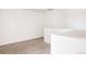 Well-lit loft area with neutral carpet and white walls at 4555 Andes St, Denver, CO 80249