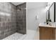 Bathroom boasts a walk-in shower and double vanity at 5030 N Bryant, Denver, CO 80221