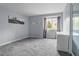 Light and airy bedroom with soft gray walls, plush carpet and a bright window offering natural light at 1193 Phipps Ct, Highlands Ranch, CO 80126