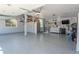 Clean, organized garage with epoxy flooring and ample storage solutions at 1193 Phipps Ct, Highlands Ranch, CO 80126