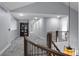 Bright hallway with elegant staircase, plush carpet and detailed trim for a luxurious feel at 1193 Phipps Ct, Highlands Ranch, CO 80126