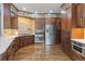 Gourmet kitchen with stainless steel appliances, custom cabinetry, and hardwood floors at 1193 Phipps Ct, Highlands Ranch, CO 80126