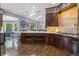 Well-appointed kitchen featuring an island, custom cabinets and stainless steel appliances at 1193 Phipps Ct, Highlands Ranch, CO 80126