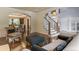 Open-concept living space with a staircase, dining area, and hardwood floors at 1193 Phipps Ct, Highlands Ranch, CO 80126