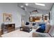 Spacious living room with a cathedral ceiling, large windows, and hardwood floors at 1193 Phipps Ct, Highlands Ranch, CO 80126