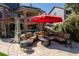 A large patio offers an outdoor seating area with a fire pit and multiple heaters at 1193 Phipps Ct, Highlands Ranch, CO 80126