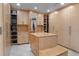 Spacious walk-in closet with custom cabinetry and ample shelving for organization at 1193 Phipps Ct, Highlands Ranch, CO 80126