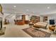 Finished basement featuring a stone fireplace, bar area, and library at 11 Canon Pl, Greenwood Village, CO 80111