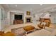 Finished basement featuring a fireplace, television, and stairs to a bar at 11 Canon Pl, Greenwood Village, CO 80111