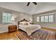 Serene bedroom with vaulted ceilings, hardwood floors, and ample natural light at 11 Canon Pl, Greenwood Village, CO 80111