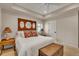 Comfortable bedroom with tray ceiling, and decorative headboard with mirrors, creating a relaxing atmosphere at 11 Canon Pl, Greenwood Village, CO 80111