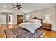 Spacious bedroom featuring wood floors, ceiling fan, and ample natural light at 11 Canon Pl, Greenwood Village, CO 80111