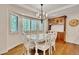 Bright dining room features large windows, chandelier and hardwood floors at 11 Canon Pl, Greenwood Village, CO 80111