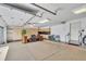 Spacious garage with ample storage cabinets, epoxy floor and room for multiple vehicles and projects at 11 Canon Pl, Greenwood Village, CO 80111