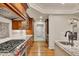Gourmet kitchen featuring stainless steel appliances, granite counters and custom cabinets at 11 Canon Pl, Greenwood Village, CO 80111