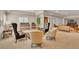 Spacious living area with ample seating, bright windows, and neutral decor, perfect for entertaining at 11 Canon Pl, Greenwood Village, CO 80111