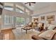 Bright living room with high ceilings, a cozy seating area, and sliding glass doors leading to the outdoor deck at 11 Canon Pl, Greenwood Village, CO 80111
