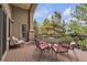 Outdoor deck with comfortable seating and beautiful views of the surrounding trees and landscape at 11 Canon Pl, Greenwood Village, CO 80111
