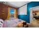Cozy bedroom with exposed brick accent wall, hardwood floors, and warm natural light at 1450 N High St # 3, Denver, CO 80218