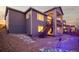 Charming two-story home boasts a stone landscape design and a cozy covered deck at 6728 Mentha Dr, Castle Rock, CO 80108