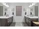 Bathroom with dual vanities featuring under-cabinet storage, modern fixtures, and stylish decor at 6728 Mentha Dr, Castle Rock, CO 80108
