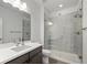 Modern bathroom features a glass enclosed shower and a sleek vanity with plenty of counter space at 6728 Mentha Dr, Castle Rock, CO 80108