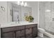 Elegant bathroom featuring a modern vanity, a shower, and a toilet at 6728 Mentha Dr, Castle Rock, CO 80108