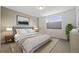 Tranquil bedroom with soft textures, a large window, and calming colors for a restful atmosphere at 6728 Mentha Dr, Castle Rock, CO 80108