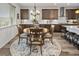 A formal dining area is situated adjacent to an open kitchen, with modern backsplash at 6728 Mentha Dr, Castle Rock, CO 80108