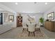 Cozy dining room with a wood table set for dinner, enhanced by natural light and stylish furnishings at 6728 Mentha Dr, Castle Rock, CO 80108