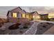 Charming home featuring a well-maintained lawn, attractive stone accents, and a welcoming entrance at 6728 Mentha Dr, Castle Rock, CO 80108