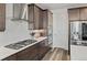 Modern kitchen featuring stainless steel appliances, including a gas range and double ovens at 6728 Mentha Dr, Castle Rock, CO 80108