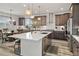 Bright kitchen featuring an island, stainless appliances, pendant lighting and wooden cabinets at 6728 Mentha Dr, Castle Rock, CO 80108