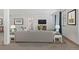 Bright living room boasts neutral tones, a comfortable sofa, and stylish decor for relaxing and entertaining at 6728 Mentha Dr, Castle Rock, CO 80108