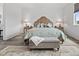Inviting main bedroom featuring neutral tones, soft lighting and wood furnishings at 6728 Mentha Dr, Castle Rock, CO 80108
