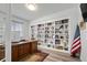 Home office featuring custom built-in shelving and a large desk perfect for remote work or study at 6728 Mentha Dr, Castle Rock, CO 80108