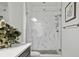 Beautiful glass shower featuring designer tile and a modern rain shower head at 6728 Mentha Dr, Castle Rock, CO 80108